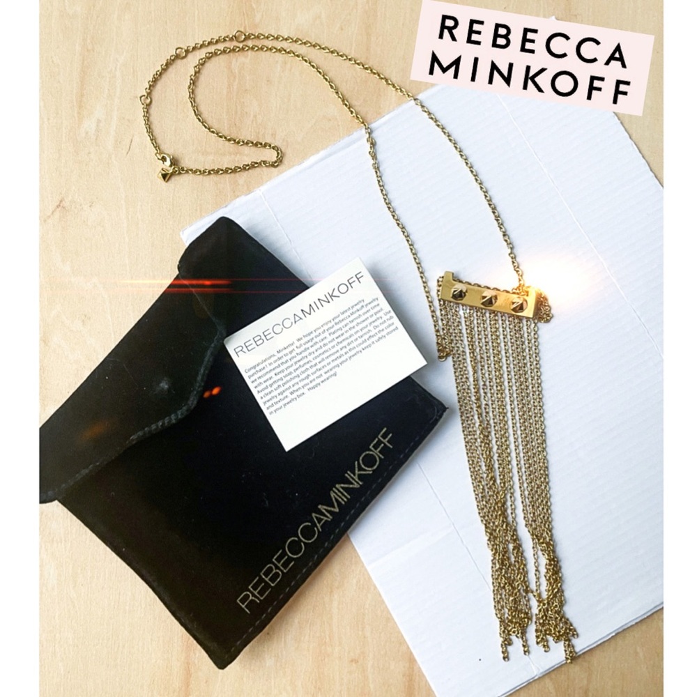 Rebecca Minkoff gold bar necklace with spikes and tassel.